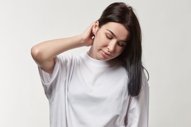 Woman wearing larger size white t shirt