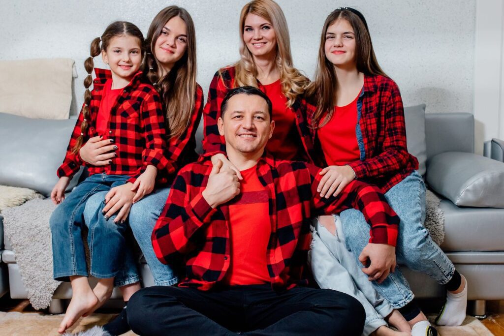 family dressed in matching shirts of the same color and style