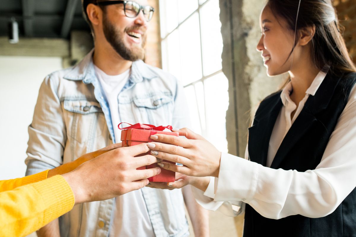 A part time employee receiving a gift from her boss