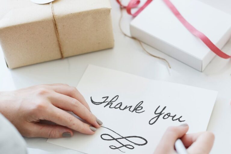 A woman packing thankyou gifts