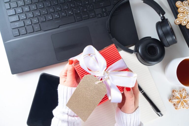 An employee receiving gifts for the new journey at the office