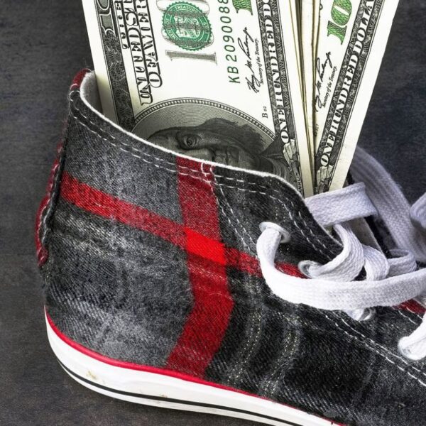 Money kept inside the custom shoe showing its cost