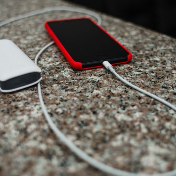 A custom charger charging a smartphone