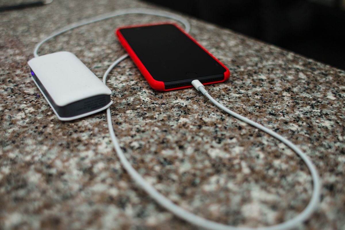 A custom charger charging a smartphone