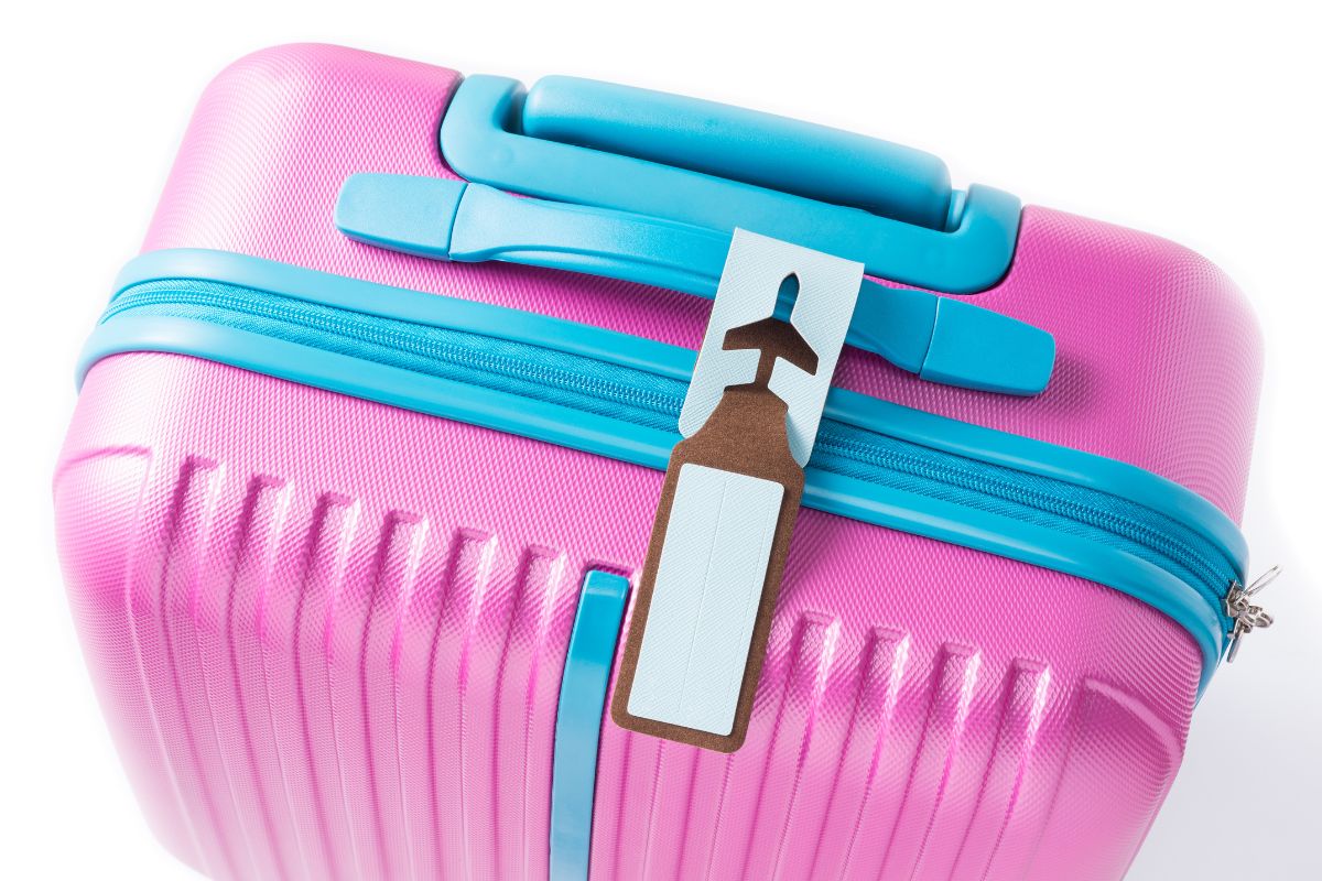 A custom luggage tag is attached to the bag