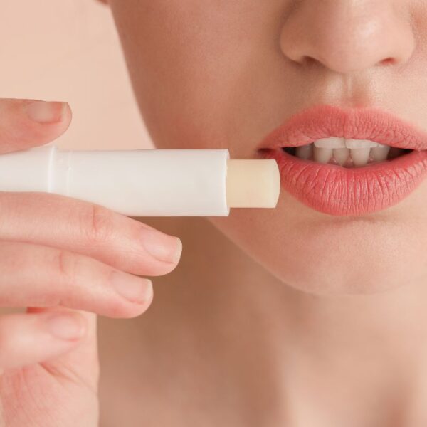 A lady using Custom lip balm