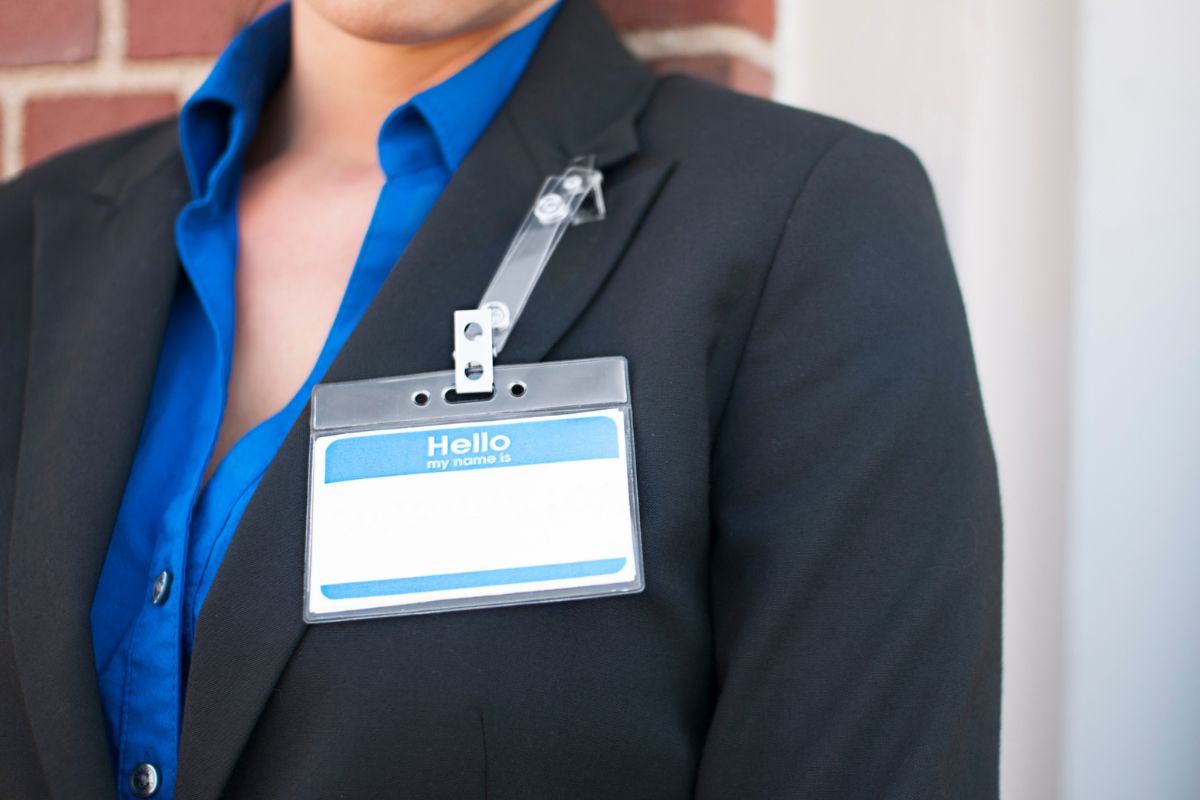 A lady wearing custom name badge