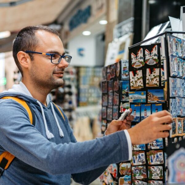 A person buying custom magnets from a shop
