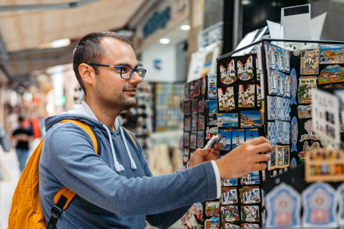 A person buying custom magnets from a shop