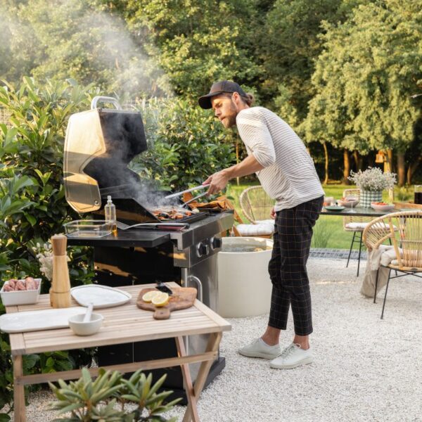 A person using custom BBQ product