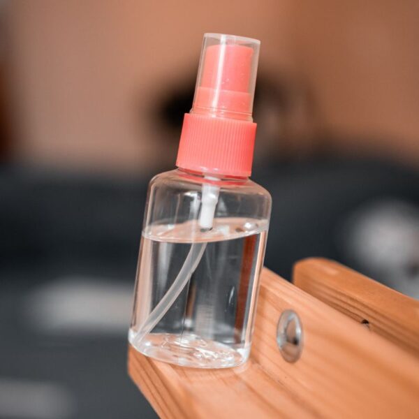 A bottle of custom lens cleaner shown in the image