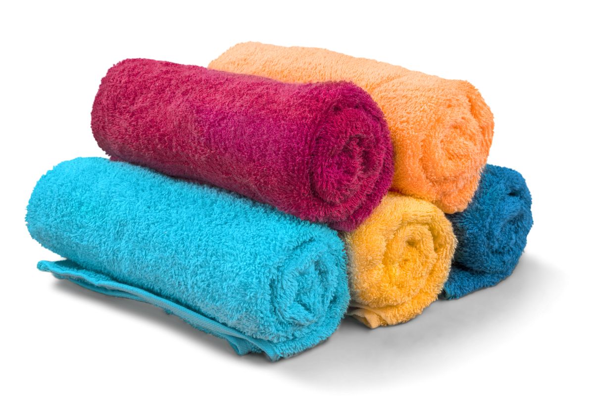 A collection of different colored custom towels shown in the image
