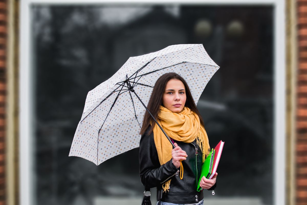 A lady holding custom printed umbrella