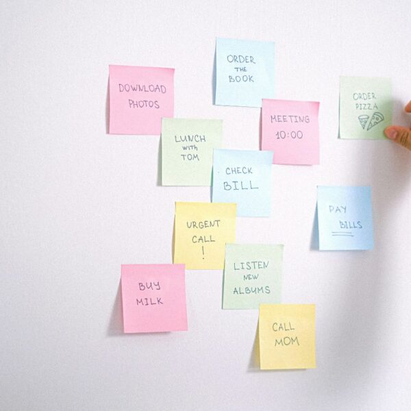 A lady is using custom sticky notes to remember important things