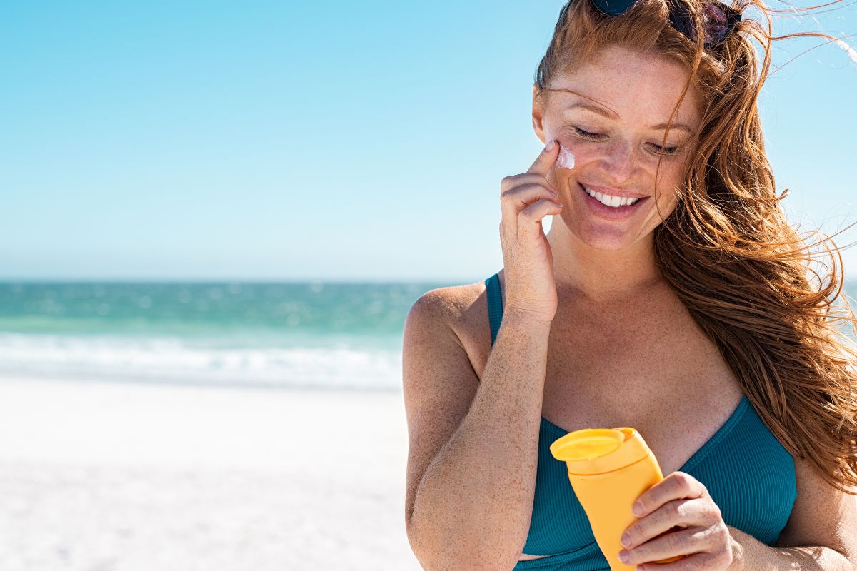 A lady using custom made sunscreen