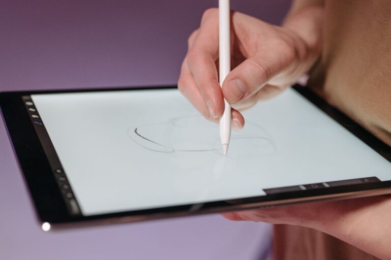 A person is using a custom stylus pen on his tablet