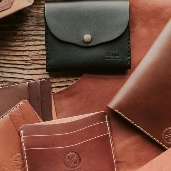 A variety of custom wallets in different colors placed together