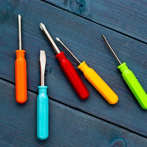 The image shows a collection of custom screwdrivers in various colors