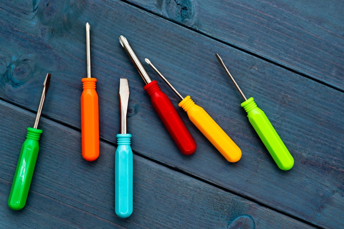 The image shows a collection of custom screwdrivers in various colors