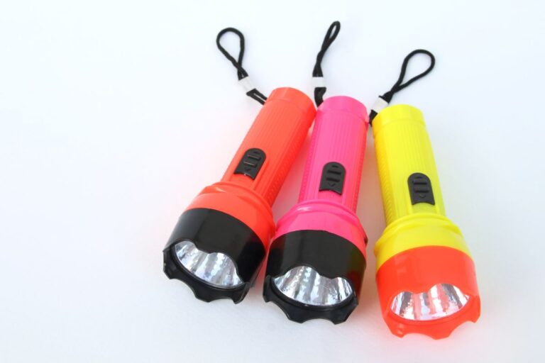 Three custom flashlights of different colors are shown in the image