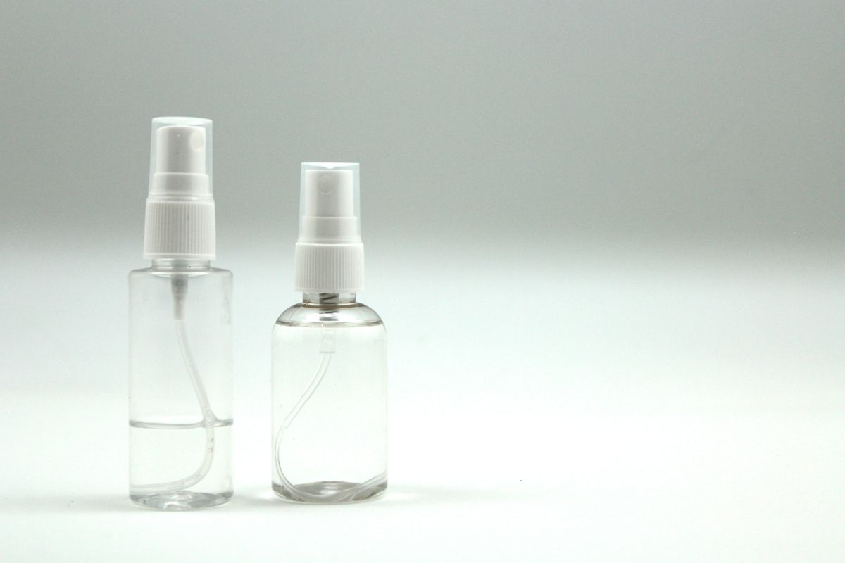Two bottles of custom lens screen cleaner are shown in the image