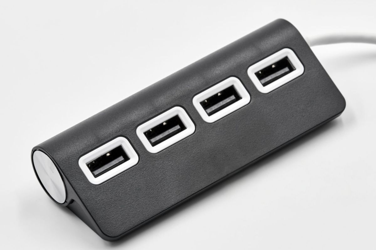 A black portable custom USB hub kept on a table