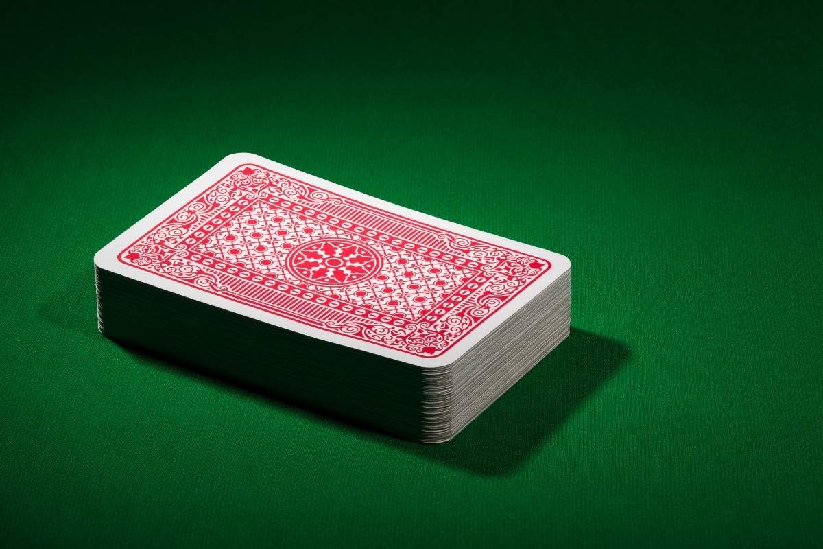 A collection of playing cards is kept on an office table