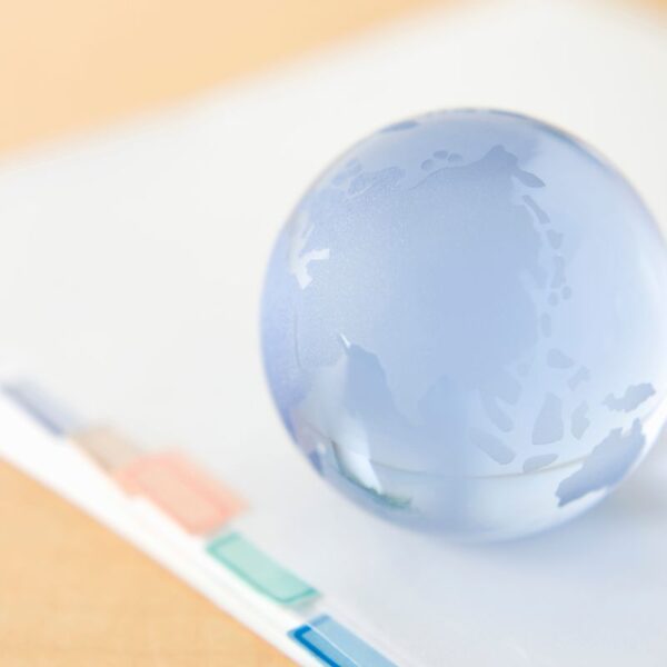 A custom paperweight placed on top of some documents