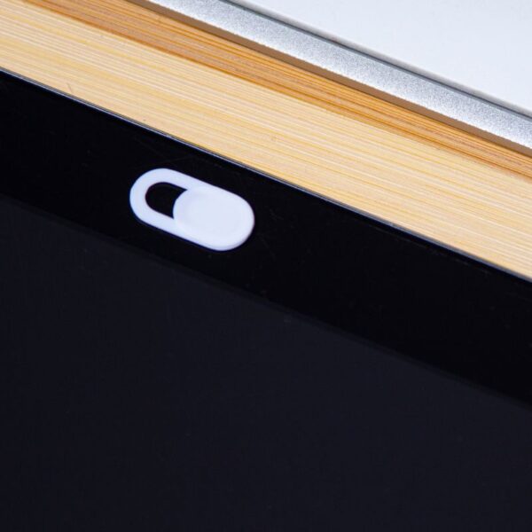 A custom slim magnetic webcam cover placed on a tablet