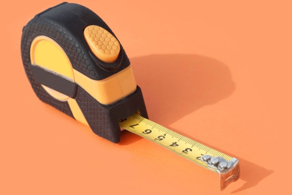 A custom tape measure featuring a button