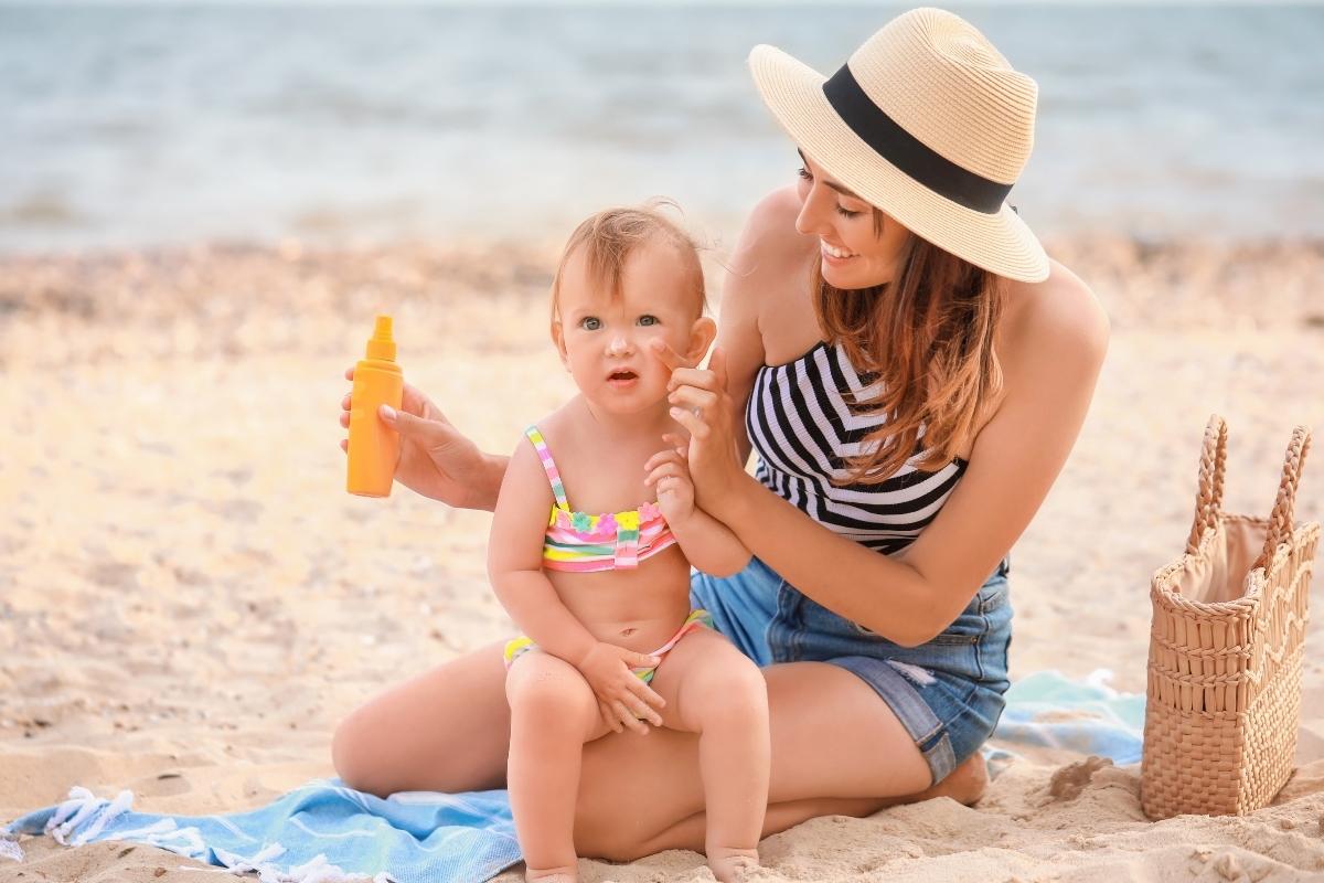 A lady applying custom sunscreen to her baby