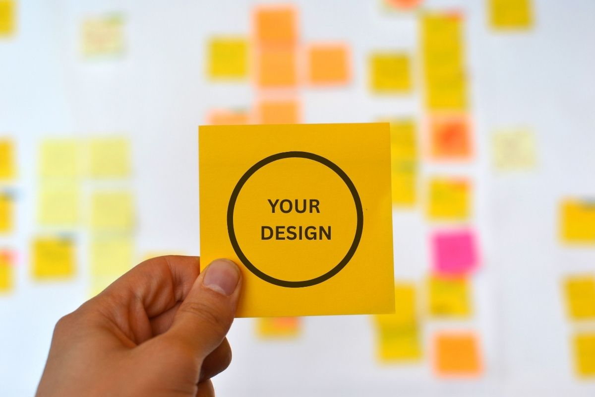 A person holding a custom recycled sticky note