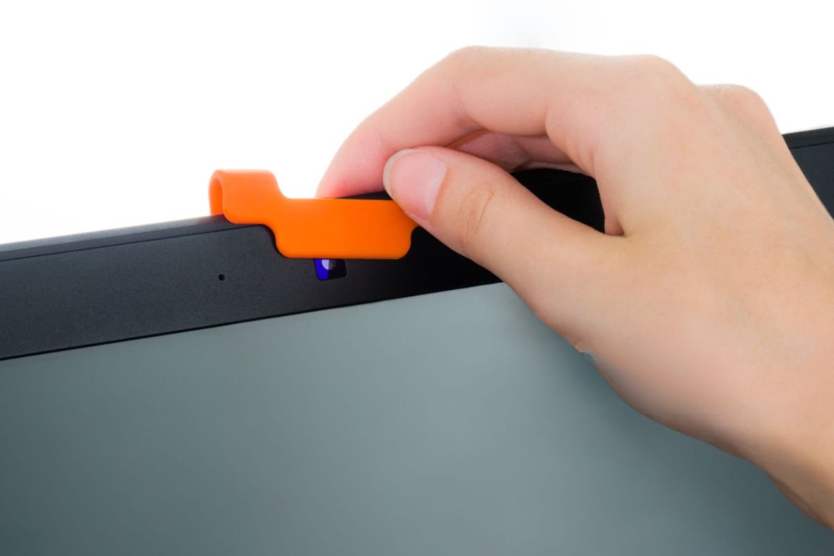 A person is using durable web cam cover
