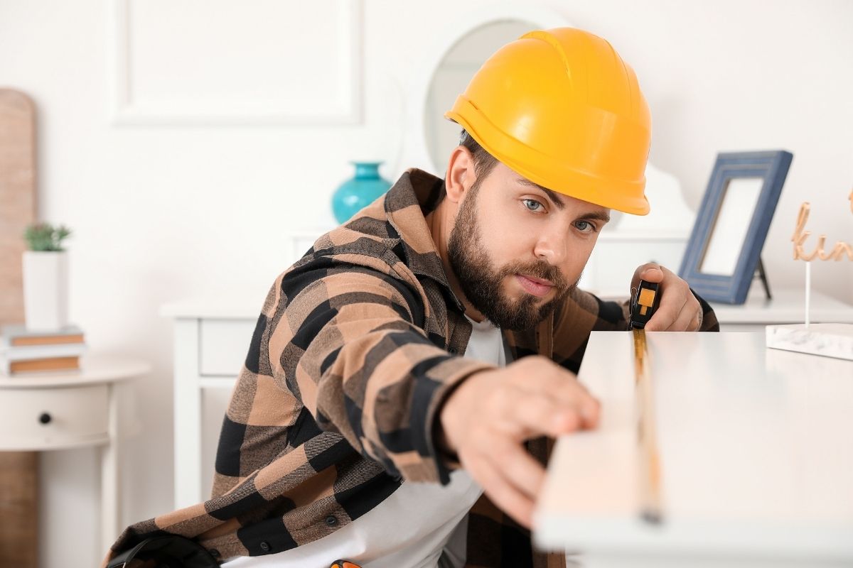 A person taking precise measurements with a custom tape measure