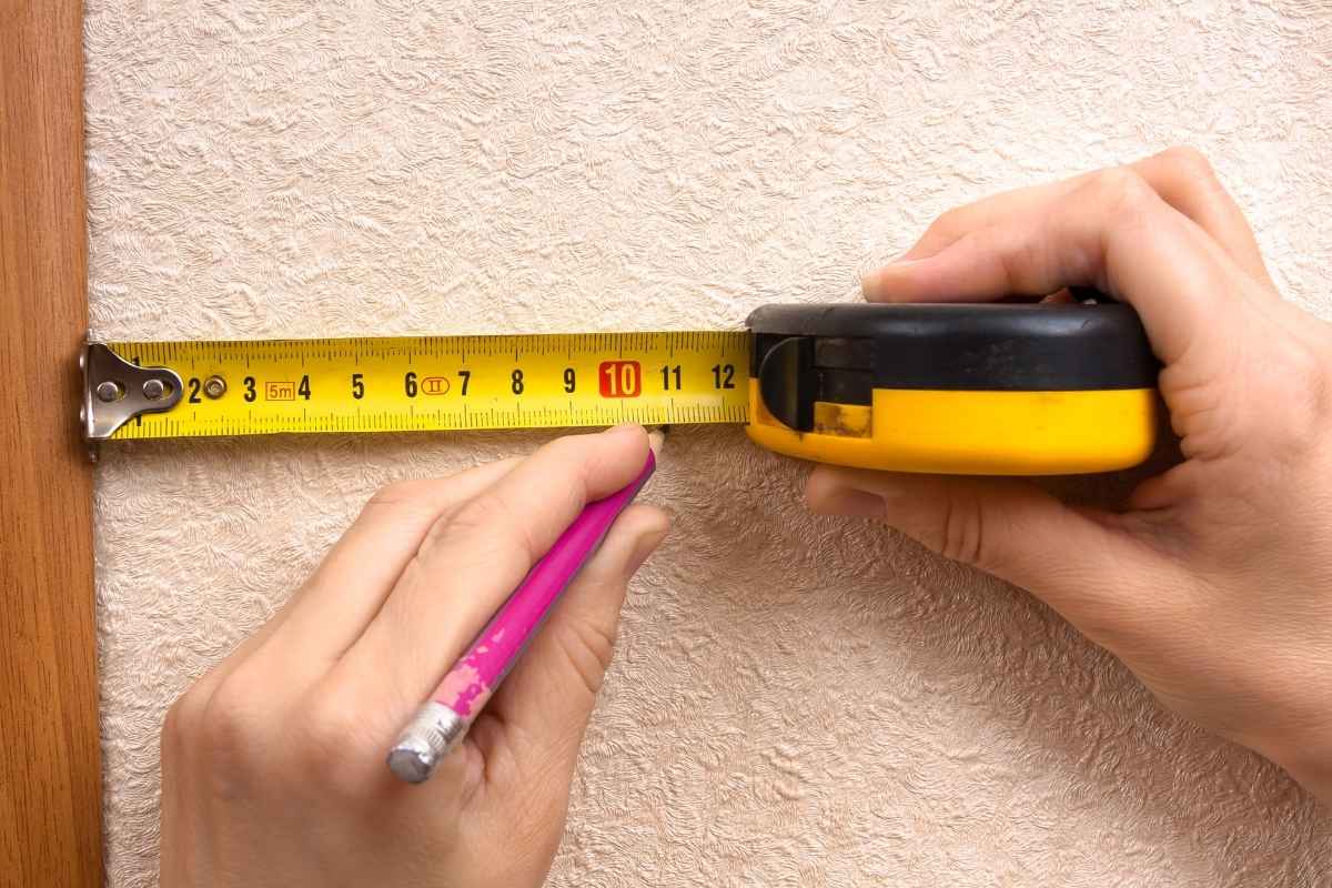 A person using a custom tape measure