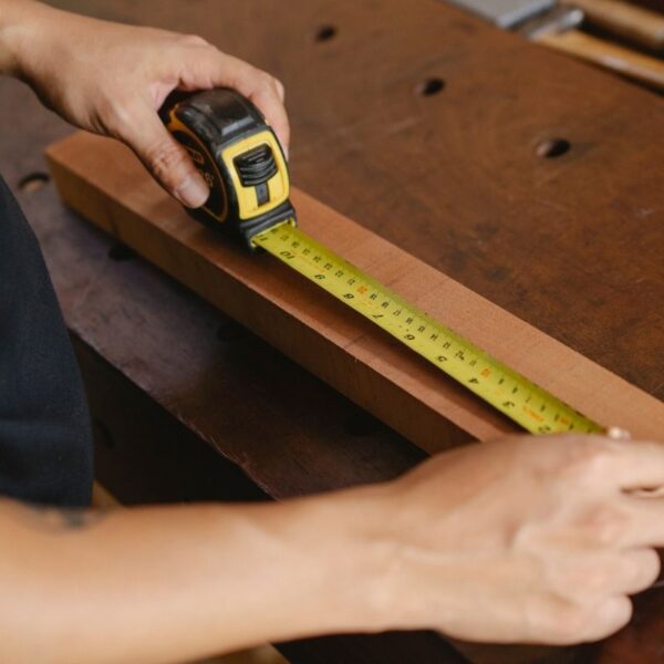 A person using custom tape measure