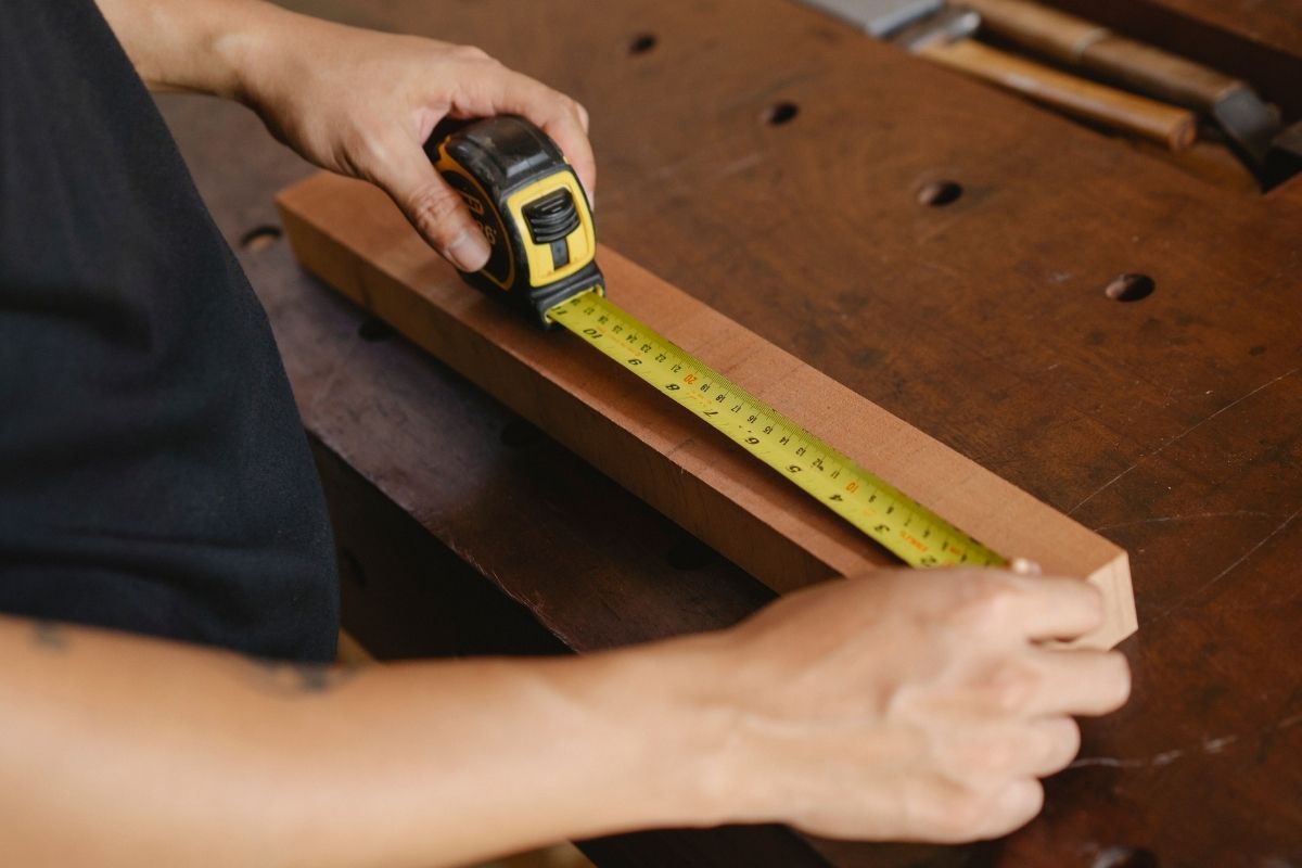 A person using custom tape measure
