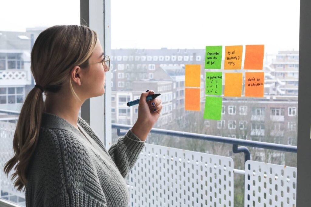 A woman planning with custom recycled sticky notes