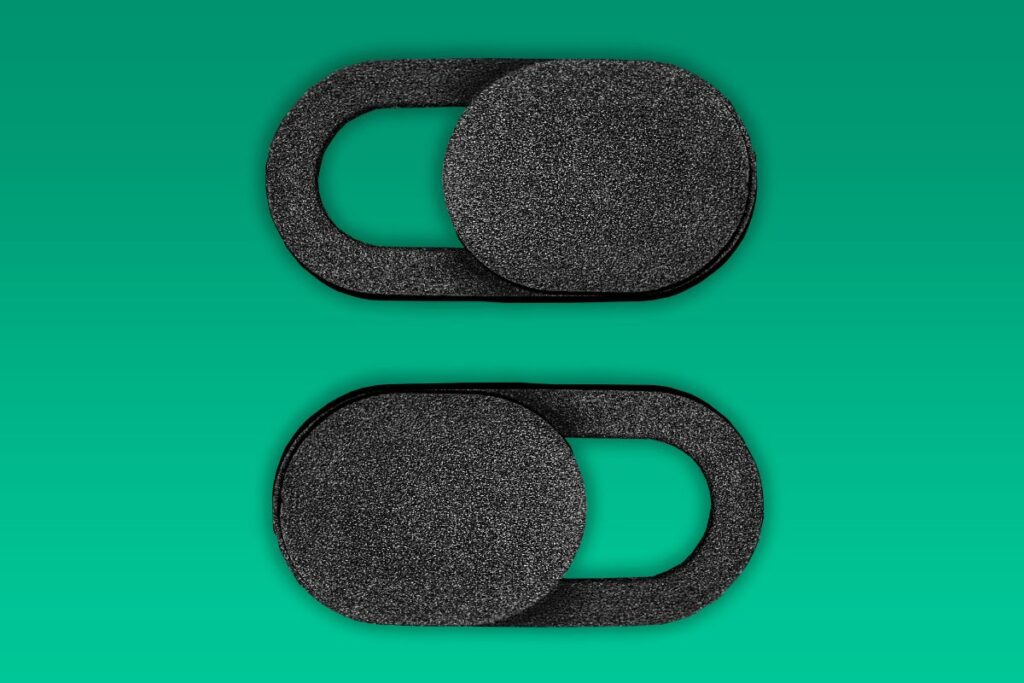 Two custom sliding webcam covers placed together