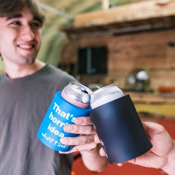 Two friends are drinking their drinks using can coolers